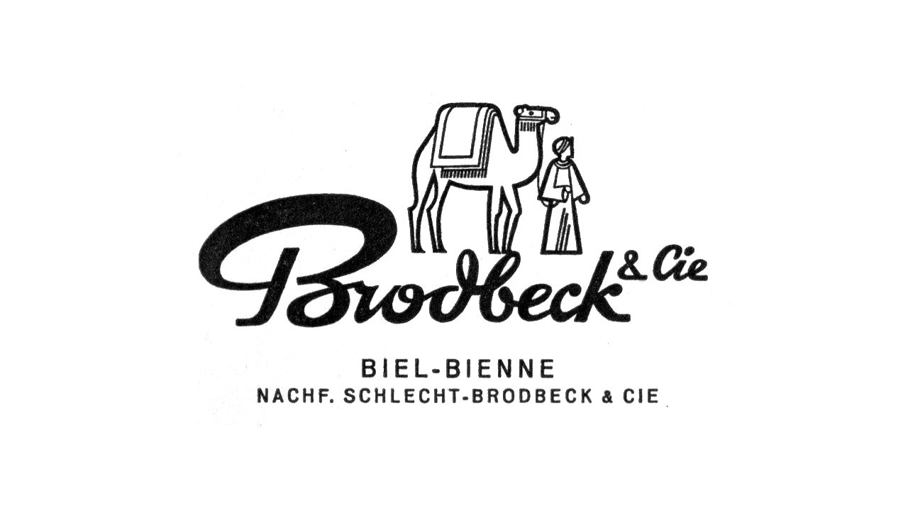 Das Logo der Brodbeck AG, wie es in den 60er Jahren aussah. Die Brodbeck Schrift in Schwarz, dahinter ein Kamel und ein Mann.
